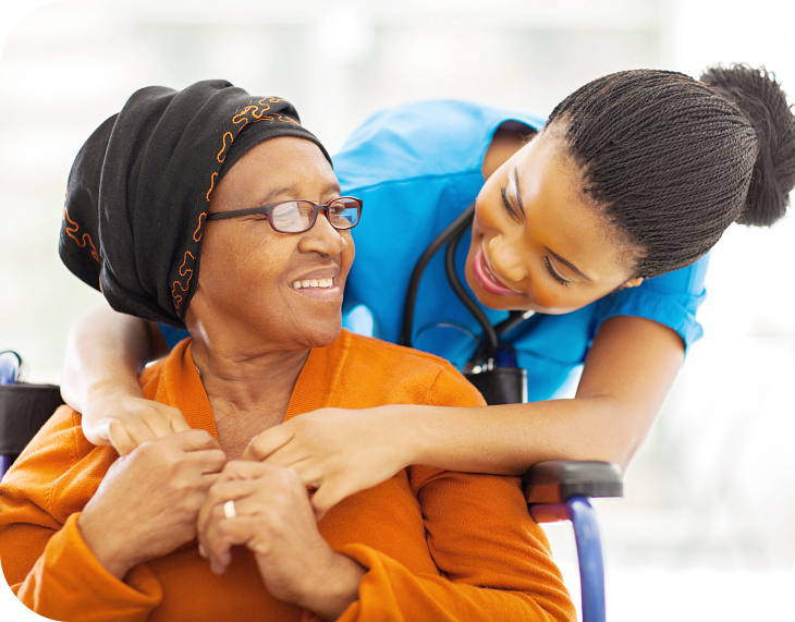 caregiver hugging elderly woman